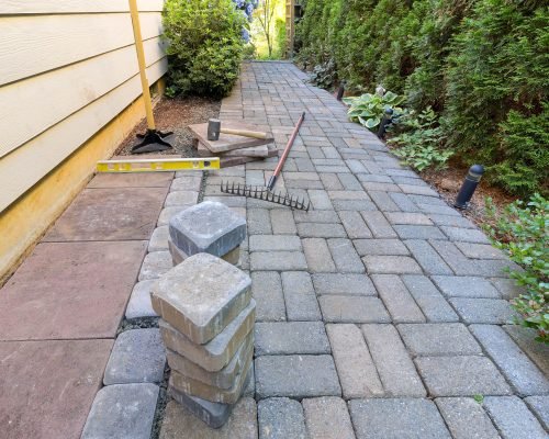 Retaining wall installation in Armonk, NY for landscape support and aesthetic appeal